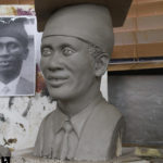 clay sculpture of a person from photos