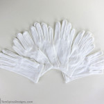 archival museum style white cotton gloves