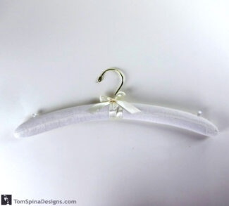 padded muslin hanger for costume and dress storage