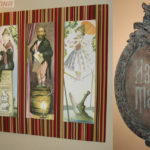 Haunted Mansion replica plaque and a custom display for prints of the stretching portraits