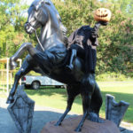 headless horseman and horse statue with tombstones