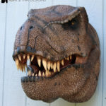 Scaled T-Rex Head Prop Bust on wall