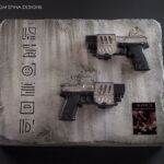 Display for Blade 2 movie prop pistols