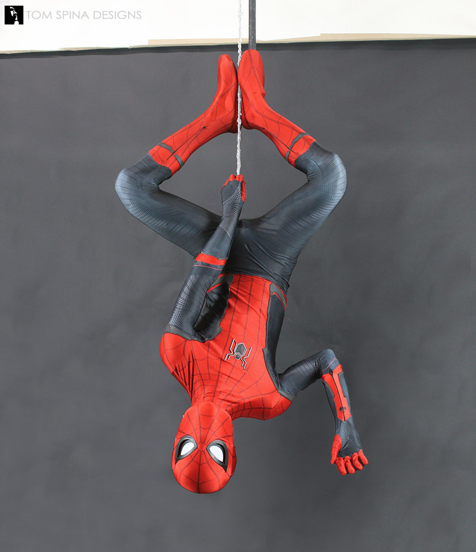 Spider-man costume display on custom mannequin that hangs from webbing